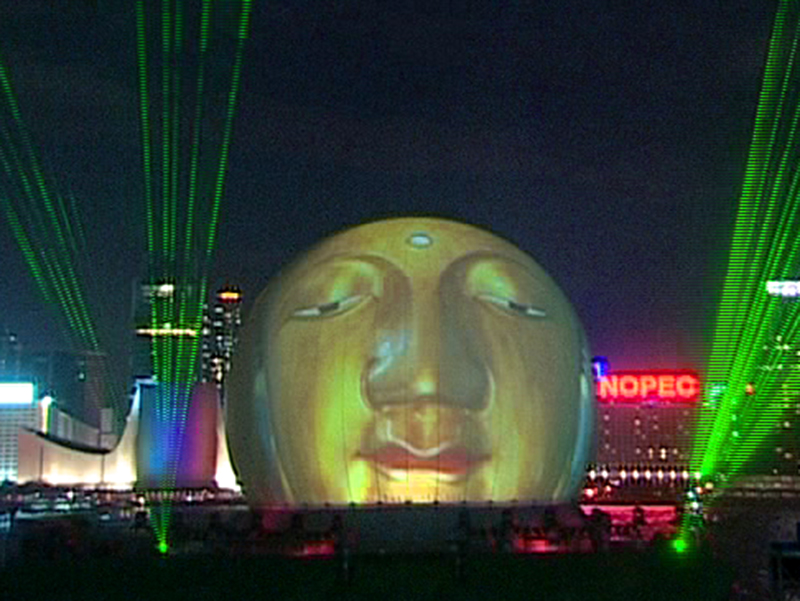 StratoSphere portable projection dome deployed on water barge at night in Hong Kong Harbor showing all-weather capability