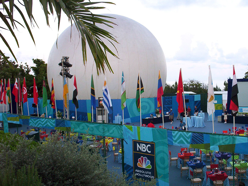 StratoSphere dome on tennis court surrounded by palm trees and beach for NBC Olympics executive event with dual 360 projection