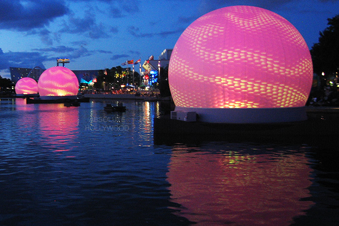 Absolute Hollywood permanent projection spheres Universal Studios Orlando Cinesphere lagoon installation glowing pink exterior projection night reflection water