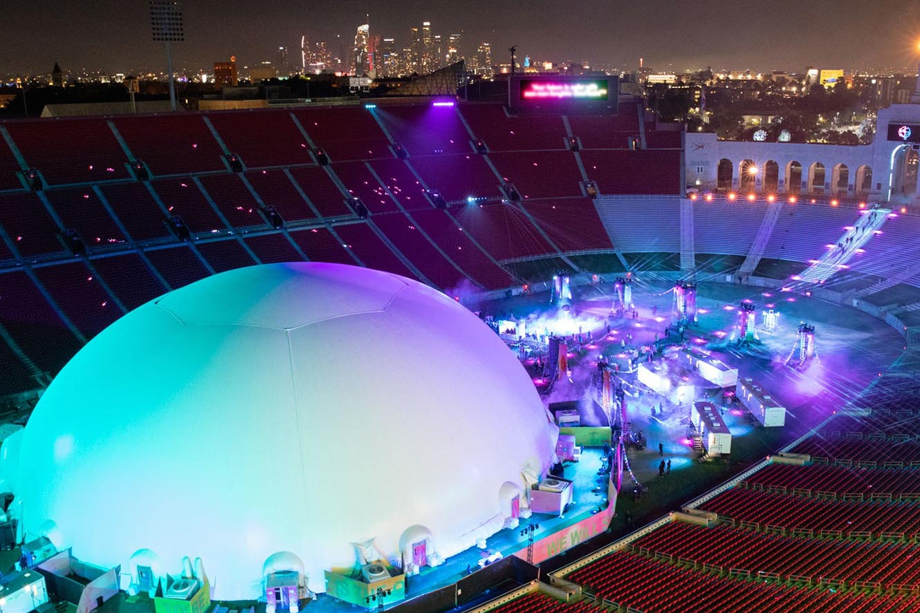 Absolute Hollywood Celestial large projection dome aerial view LA Coliseum Los Angeles Skrillex concert activation inflatable dome stadium scale downtown skyline night