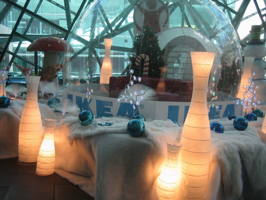 Giant inflatable snow globe for the IKEA brand activation — oversized ornaments, falling snow, IKEA base banner, by Absolute Hollywood