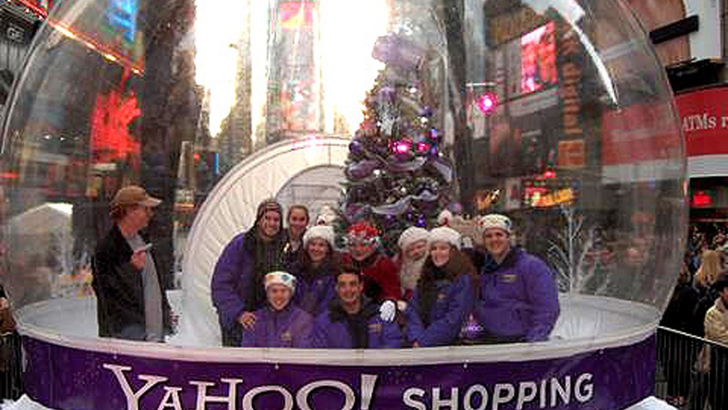 Snow globe photo booth packed with guests at the Yahoo! Shopping activation, Times Square, New York, 2004 — Absolute Hollywood walk-in globe