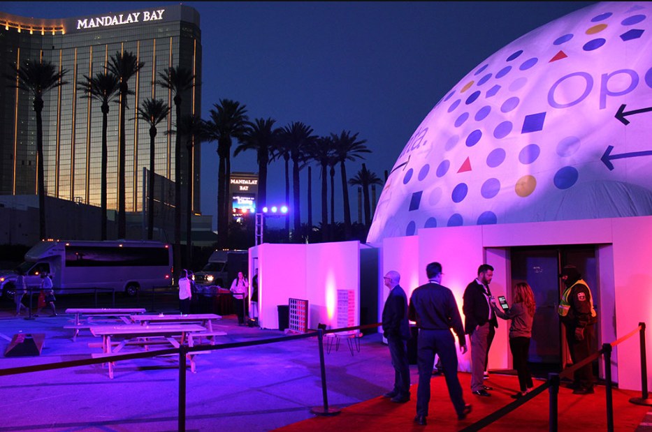 80 ft large projection dome with a custom-printed IBM dome cover at night outside Mandalay Bay, Las Vegas