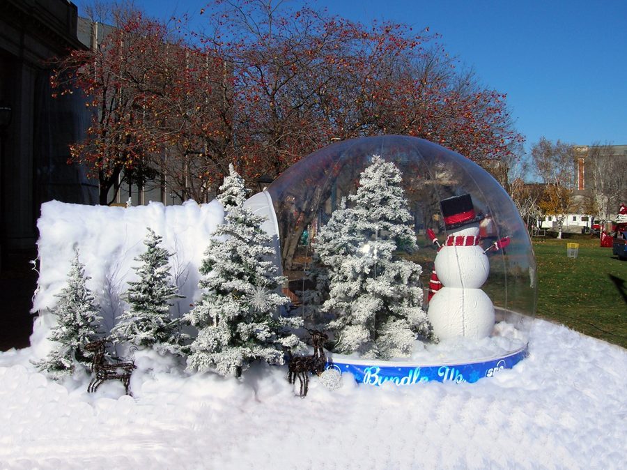 Life size snow globe with snowman and flocked trees at an SBC municipal winter festival — Absolute Hollywood commercial-grade globe