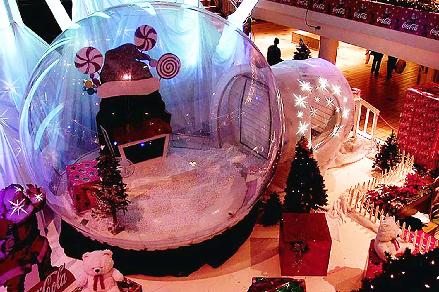 12-foot human snow globe with airlock tunnel entry at the Coca-Cola holiday activation, San Patricio Plaza, San Juan, Puerto Rico