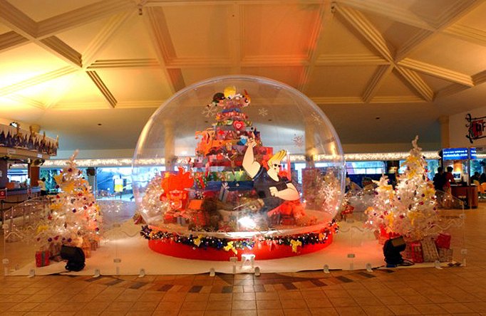 Sixteen foot giant snow globe with a decorated tree inside at the Government of Singapore holiday celebration for municipal staff
