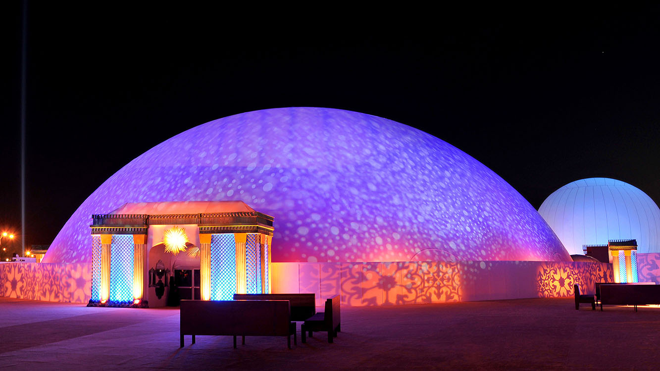 Celestial projection dome exterior night — 200-foot inflatable projection dome deployment Doha Qatar 360 video projection