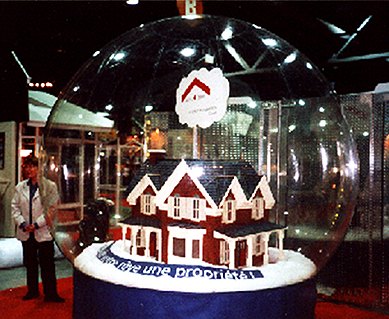 Custom fabricated model house installed and lit inside a giant snow globe at a convention center in Montreal, Canada