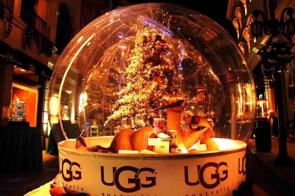 Giant snow globe lit warm gold after dark on Rodeo Drive for sponsor UGG Australia at the Ice Age 2 release