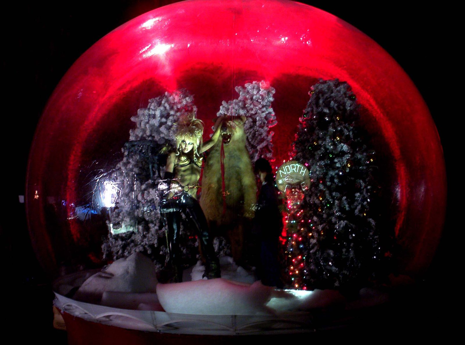 Custom themed winter interior built inside a giant snow globe for the Kiss Kiss Bang Bang production, lit for camera
