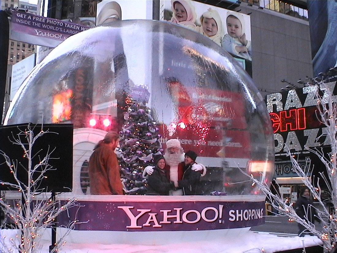 Santa and guests photographed inside the 16 ft Yahoo Shopping giant snow globe in Times Square, New York, 2004