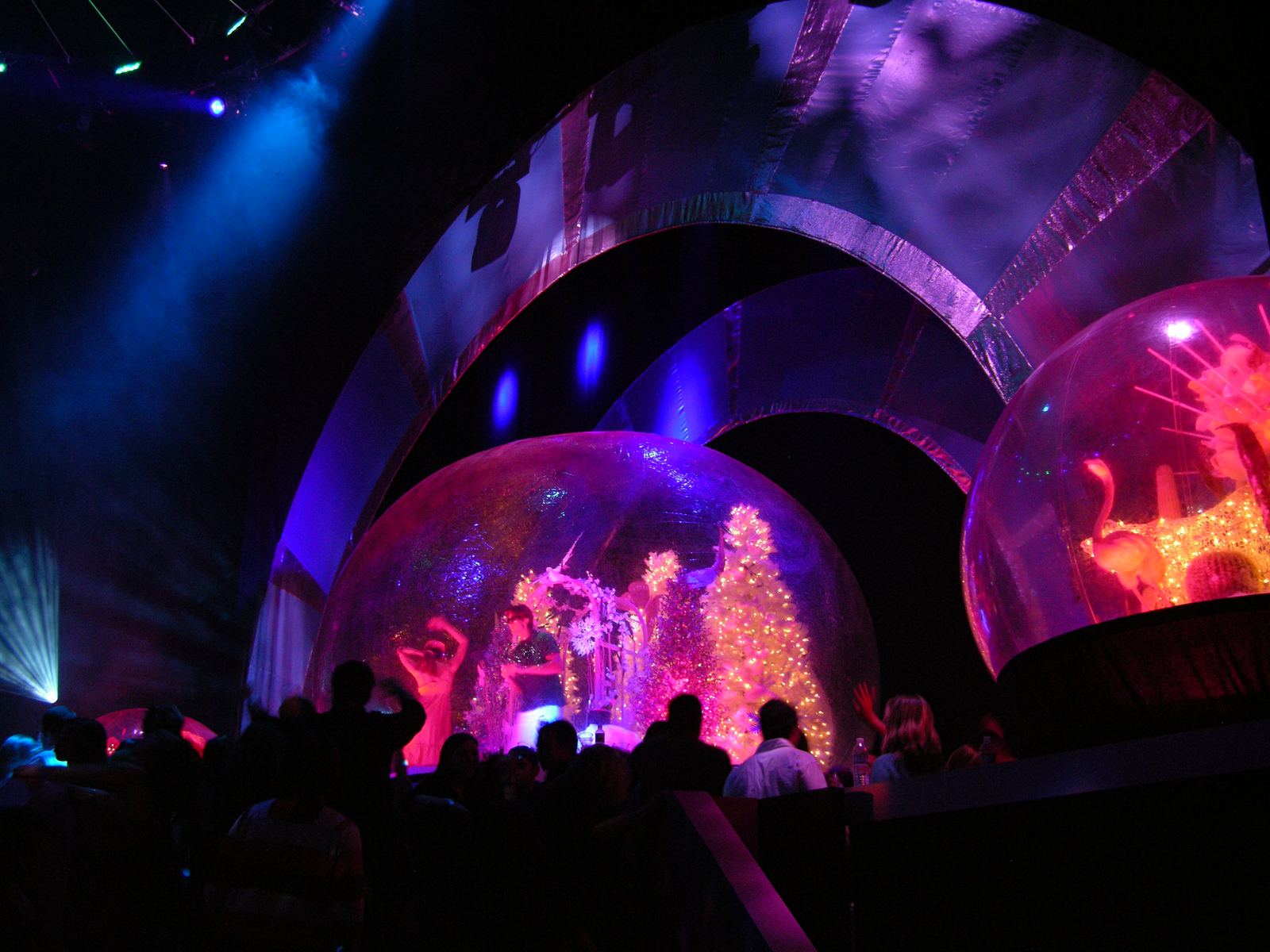 Two giant snow globes flanking the stage arch at the MTV holiday party, New York, lit for a live broadcast audience
