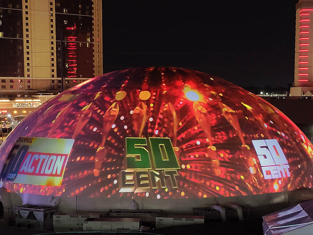 Inflatable projection dome exterior night — Galactic series 360 video dome Las Vegas Strip event activation
