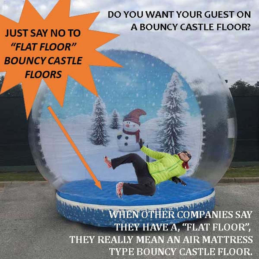 Guest losing their footing on an inflatable air mattress floor inside a competitor snow globe with a snowman backdrop